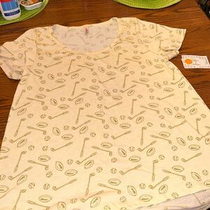 Cream sports theme lularoe tee shirt